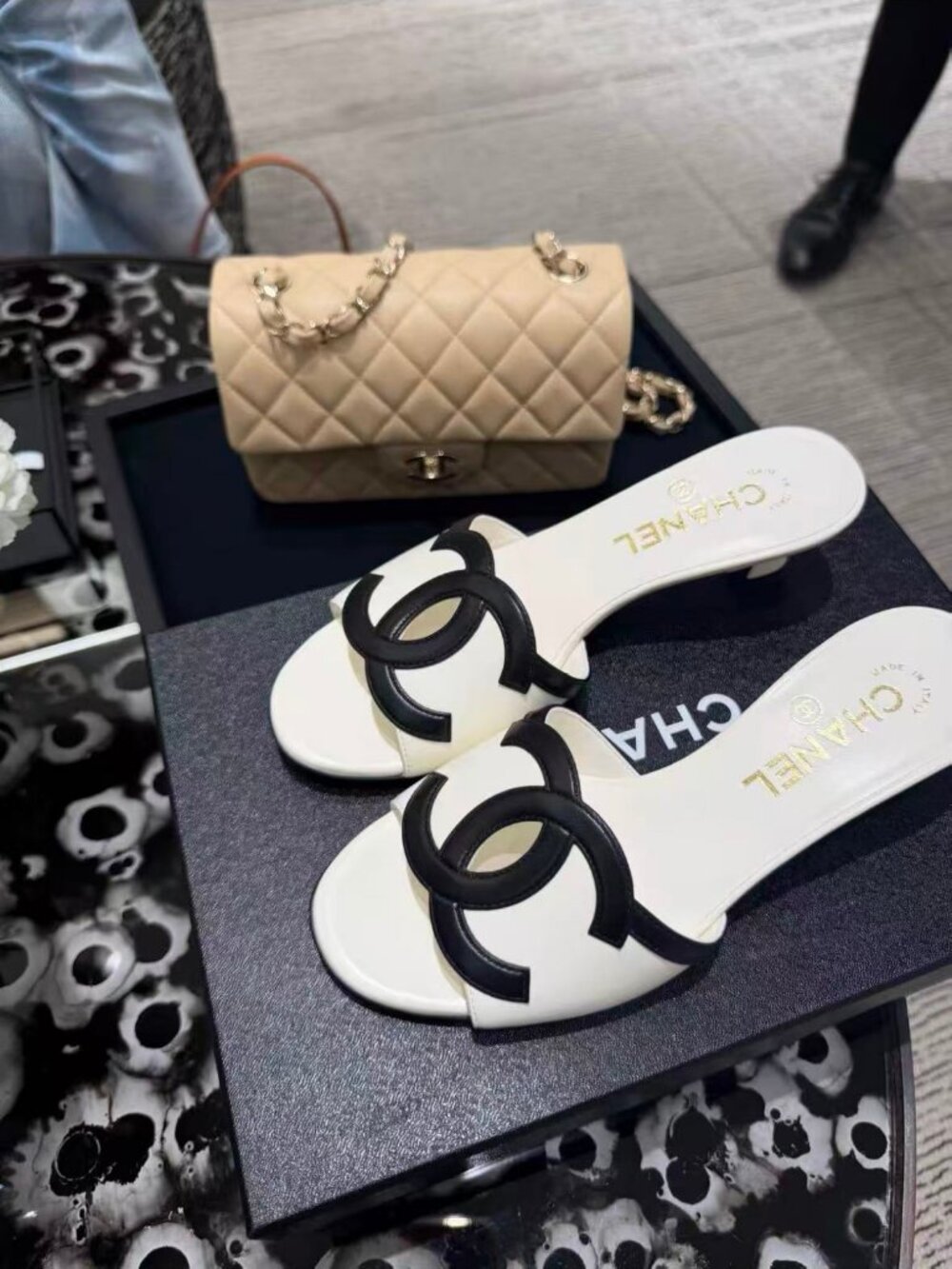 Chanel Women’s Leather Slide Mules Black Interlocking CC Logo White